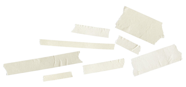 randomly scattered light cream masking tape fragments of various sizes with ripped edges, presented in a clean studio photograph isolated on black.