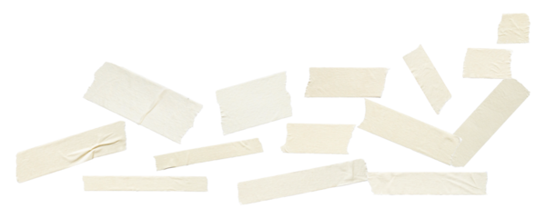 scattered arrangement of multiple pieces of clean, pale yellow adhesive masking tape in various sizes and orientations, isolated on a dark background.