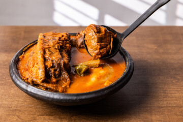 Fufu With Smoked Fish Light Soup and Goat Meat, Africa Ghana Traditional Dish