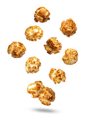 isolated pieces of crunchy caramel glazed popcorn dynamically falling and floating in mid-air...
