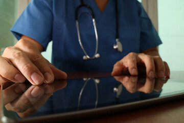Doctor Using Digital Tablet in Modern Clinic