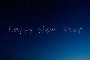 Happy new year wishes with stars on dark blue background