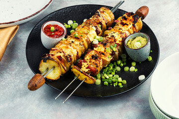 Grilled vegetable bacon kebabs.