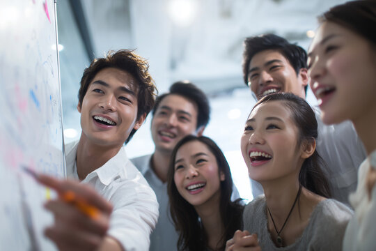 Coworkers Brainstorming at Whiteboard