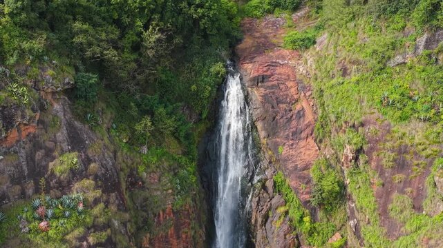 Breathtaking aerial view of Kattery Waterfalls cascading through lush green cliffs near Coonoor, Nilgiris. A stunning natural wonder capturing South India&rsquo;s serene mountain beauty and adventure spirit