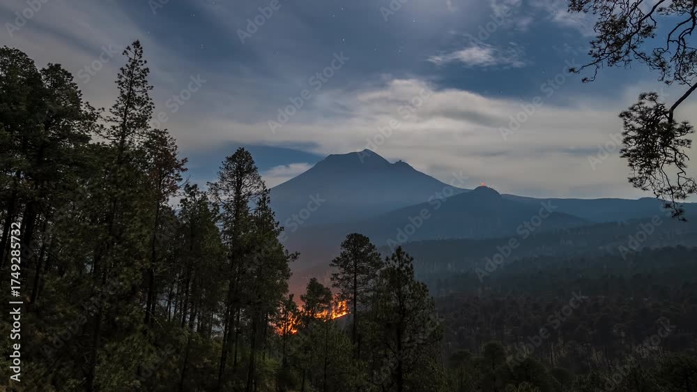 Wall mural timelapse of an active forest fire at volcán popocatépetl during the night, illuminated by a full mo