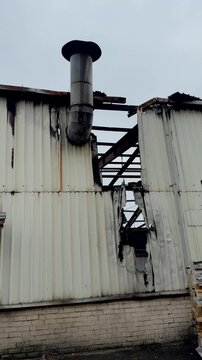 An industrial building after destruction. The aftermath of the destruction. A hangar after the fire.