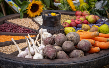 Colorful selection of  agricultural summer crops fruits and vegetables in an old wooden carriage...