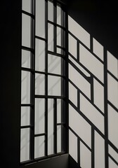 Abstract architectural monochrome composition: window pane shadows create geometric patterns on a wall surface
