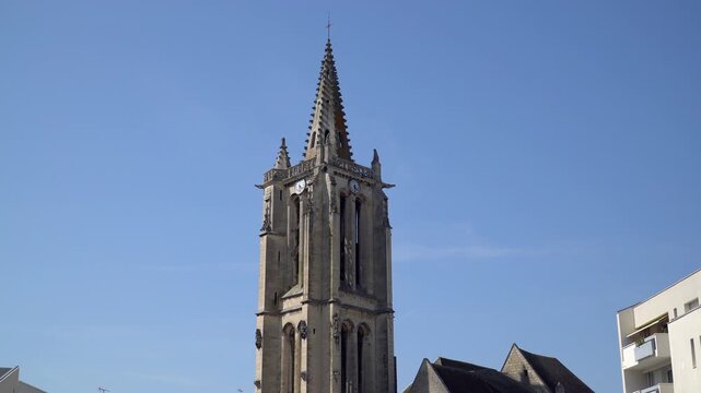 Captivating footage showcase the Clock tower of Saint-Medard church, a gothic style church in Creil, a city nestled in Oise department, northern France