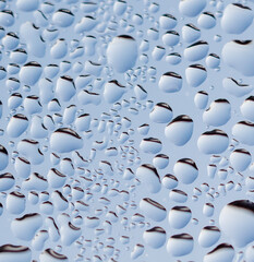 Frozen water drops on glass as an abstract background.