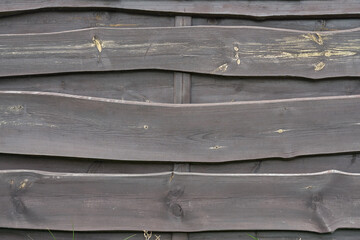 old wooden weathered curved fence