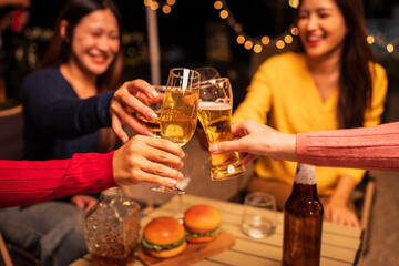 young couple celebrating with champagne at night