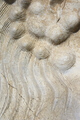 Vintage ornament on the stone. Close-up seamless texture. Stone texture. Embossed pattern.