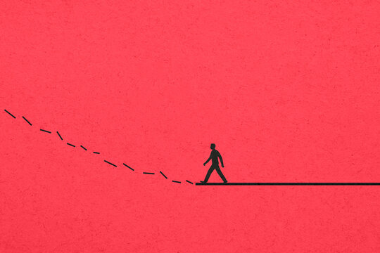 Man walking toward broken line on red background symbolizing challenge
