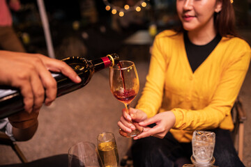 young couple drinking wine in restaurant