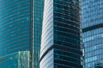 Fototapeta premium mirrored windows of the facade of an office building
