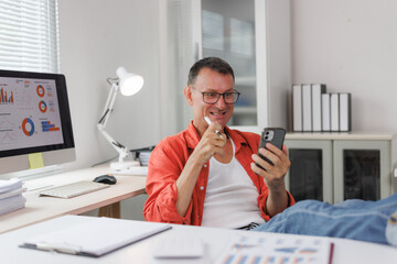 Business man working remotely with phone checking data stats