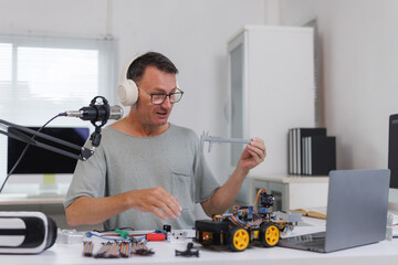 Maker creating robotics content for online learning