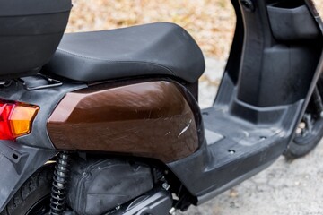 details and elements of a scooter nearby