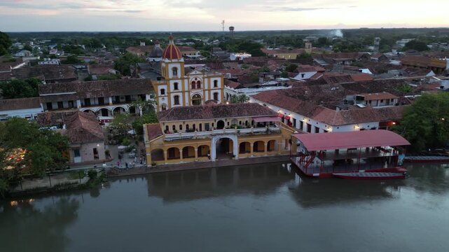 Aerial view of Santa Cruz de Mompox (Momp&oacute;s) on the banks of the Magdalena River in the Bol&iacute;var Department in Colombia, showing Plaza Real De La Concepci&oacute;n and Inmaculada Concepci&oacute;n church at sunset