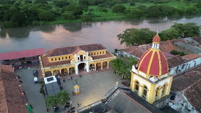 Aerial view of Santa Cruz de Mompox (Momp&oacute;s) on the banks of the Magdalena River in the Bol&iacute;var Department in Colombia at sunset, showing Plaza Real De La Concepci&oacute;n and Inmaculada Concepci&oacute;n church