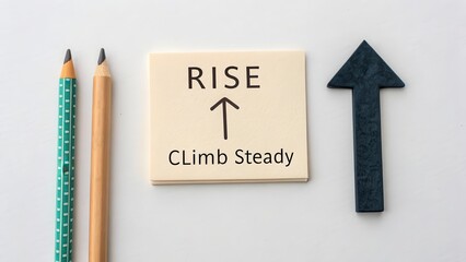 Motivational Sign with Rise and Climb Steady on Workspace Desk