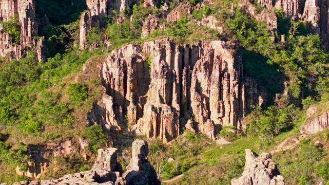 Aerial backward shot showing the eroded columns and pedestals of los estoraques in norte de santander