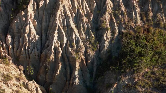 Aerial view slowly revealing the unique geological formations of los estoraques in colombia