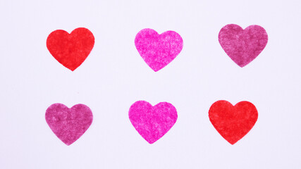 6 paper hearts on a white background