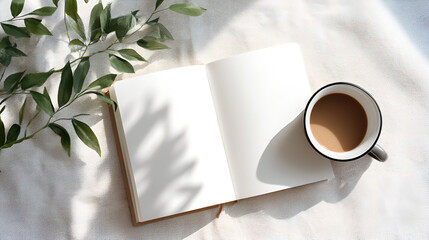 Open notebook with coffee and leaf shadows, natural light flat lay