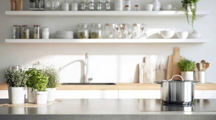 A modern kitchen with a sleek countertop, potted herbs, glassware, and minimalistic decor, emphasizing a clean, organized space.