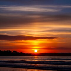 Fototapeta premium Fiery Sunset Over Calm Waters - A Tranquil Coastal Scene.