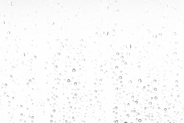 Waterdrops background on a window. White texture of rain