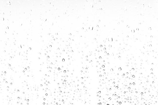 Waterdrops background on a window. White texture of rain