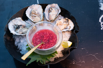 Enjoy Fresh Oysters Served with a Vibrant and Flavorful Salsa on Ice, Perfect as an Appetizer