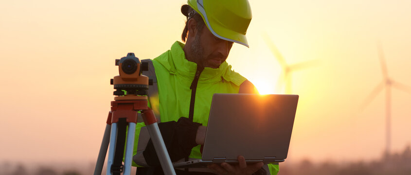 Civil engineers inspect wind farms, power generation systems, natural industry and environmental concepts, clean energy
