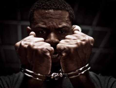 a black man in handcuffs