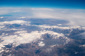 Bati raman mountains, batman river, Tigris, southeast Turkey, aerial view, clouds over snow covered mountain and valley with riverbed