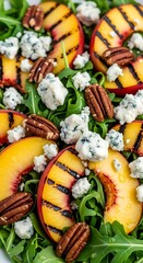 Grilled Peach Salad with Arugula, Blue Cheese, and Pecans.