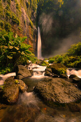 waterfall in the forest at Kapas Biru Waterfall Pronojiwo Lumajang East Java Indonesia
