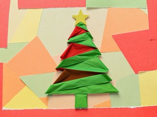 Artistic minimalist Christmas tree crafted from colorful paper ribbons, celebrating holiday spirit with clean design and festive charm.