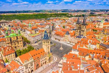 Drone photo of Prague Old Town Square showing the old cathedral, colorful historic buildings, cobblestone streets and lively atmosphere in the Czech capital city