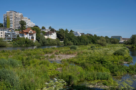Urban buildings along Ruhr river and nature reserve in Muelheim an der Ruhr