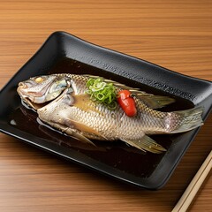 Delicious Braised Fish Dish on a Black Plate.