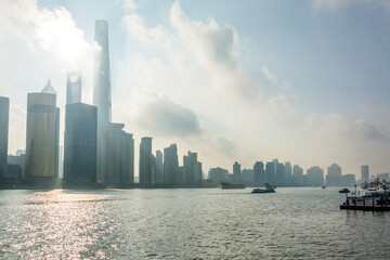 Sunlight Reflecting on River with Skyscrapers in Distance