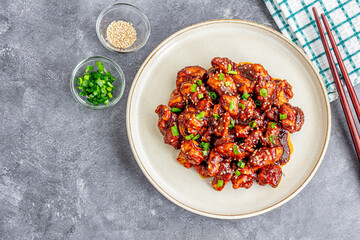 Easy Crispy Sesame Chicken with Chopsticks, Garnished with Lemon, Top Down Asian Food Photo
