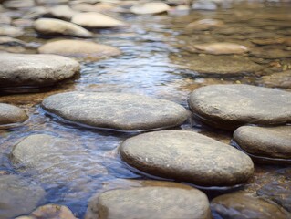 shallow. Smooth water-worn pebbles on a shallow stream bed with clear water flowing over them. travel magazines, destination branding, designed for travel destination branding.