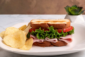 ham sandwich with a side of   french fries