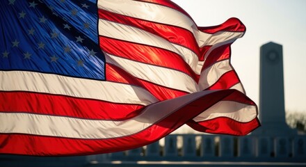 Waving American Flag with Monument Silhouette, Patriotic Symbolism, Bright Sunlight